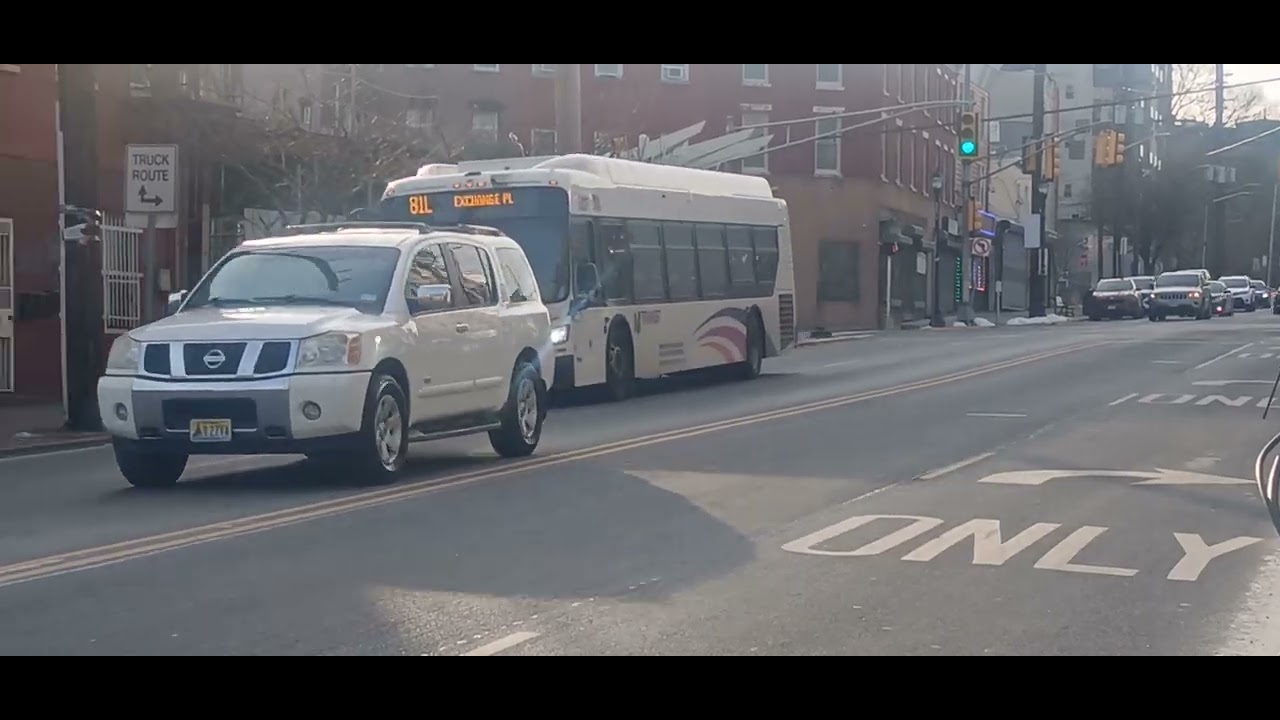 Jersey city police car  and a new jersey transit bus 81L to exchange place 25237