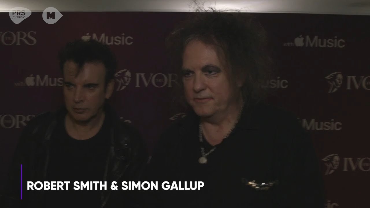 Robert Smith and Simon Gallup pick up the PRS for Music Icon Award at The Ivor Novello Awards 2022