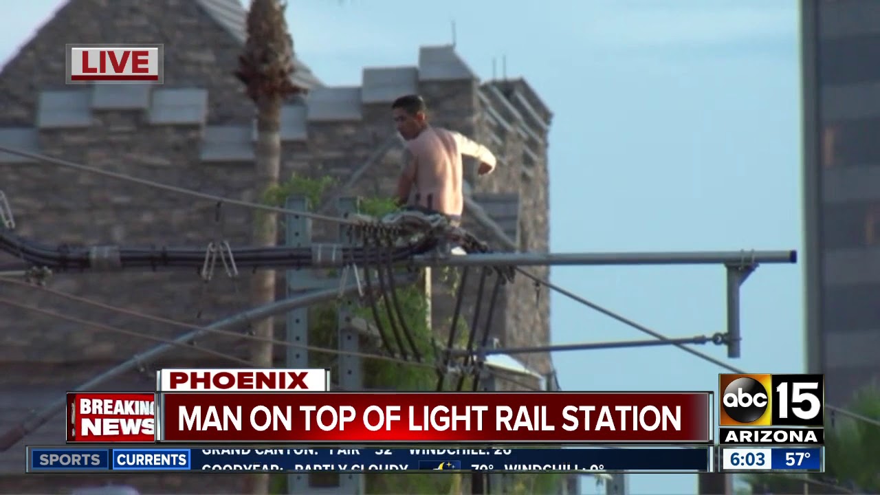 Man on top of light rail platform shuts down Central Avenue