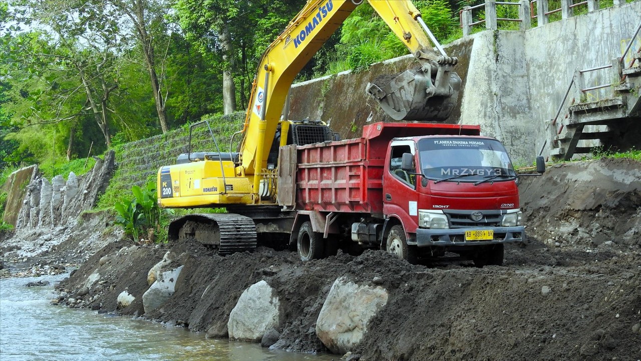 Komatsu PC210 Excavator Crane Truck and Ready Mix Working on River Groundsill Construction