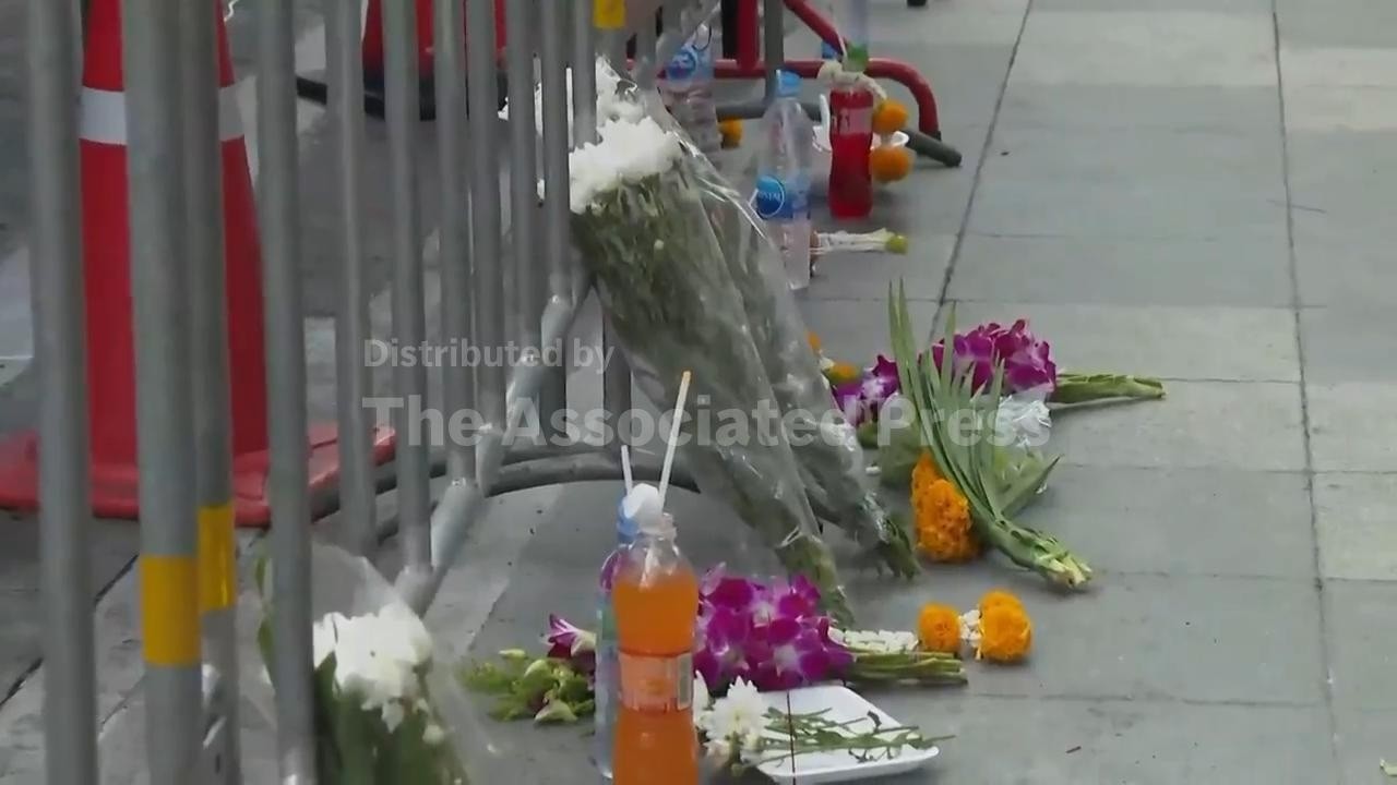 Tributes left at scene of deadly Bangkok pub fire as probe continues
