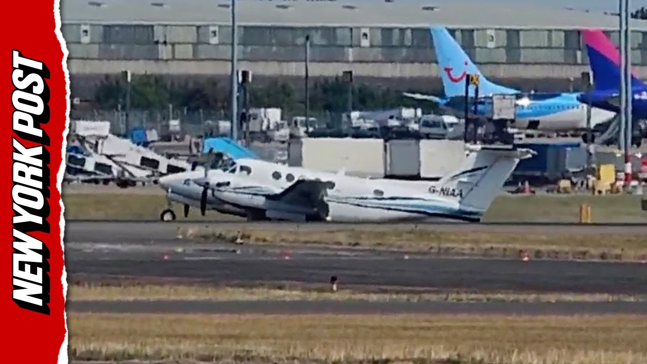 Plane SKIDS down runway during emergency landing