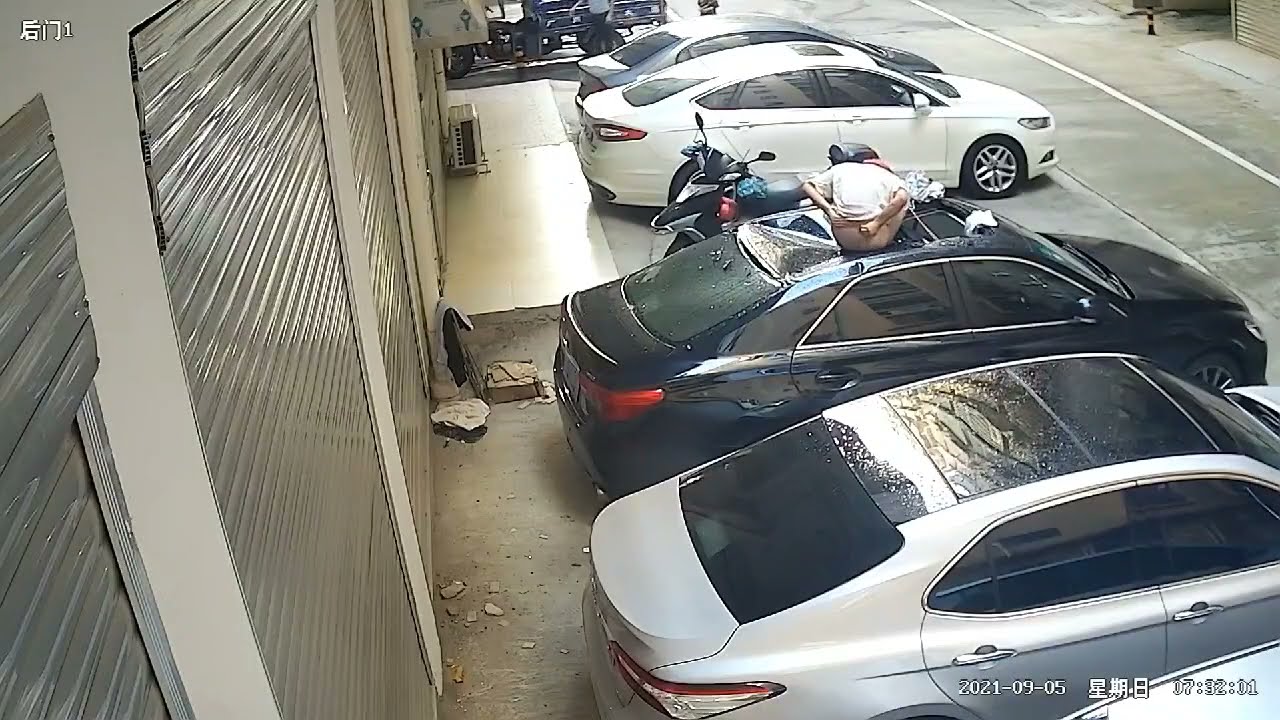 Woman falls hard over parked car