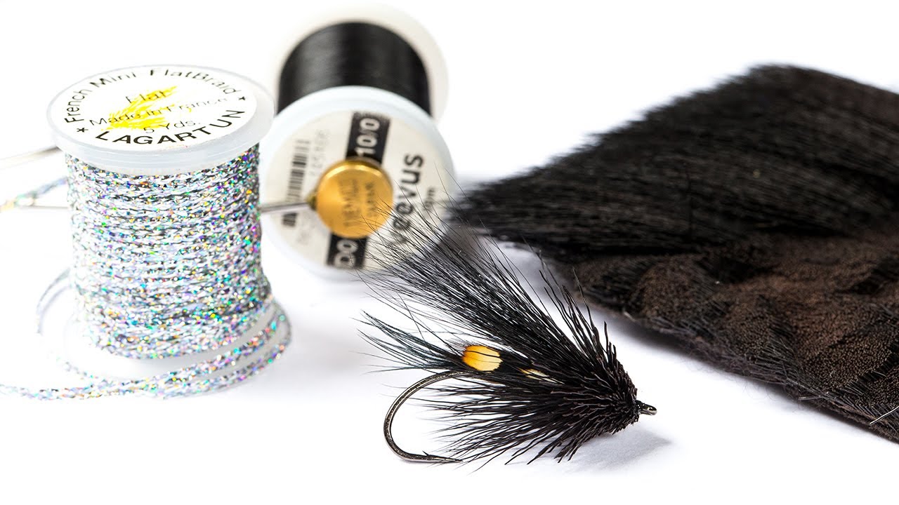 Модель мушки для поверхностной приманки Muddler Minnow Black & Silver. Ловля морской форели нахлы...