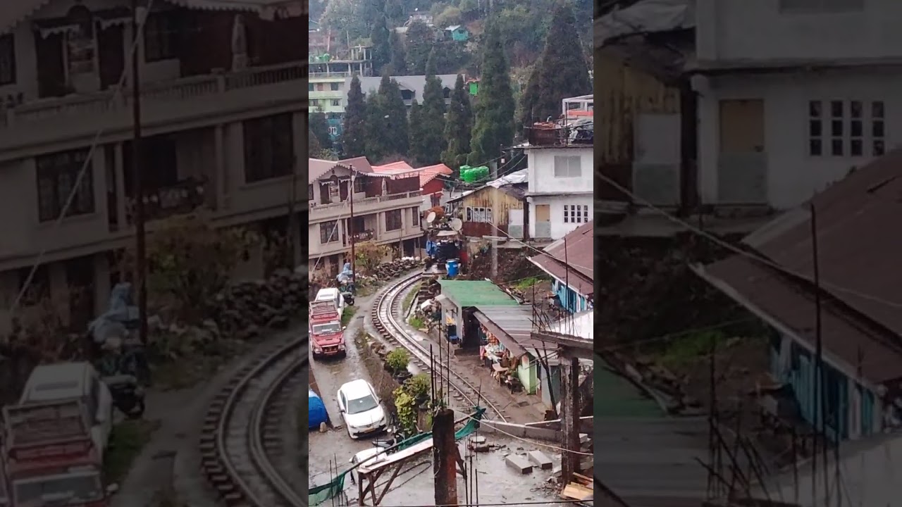 The Darjeeling Toy Train Running On The Tracks 