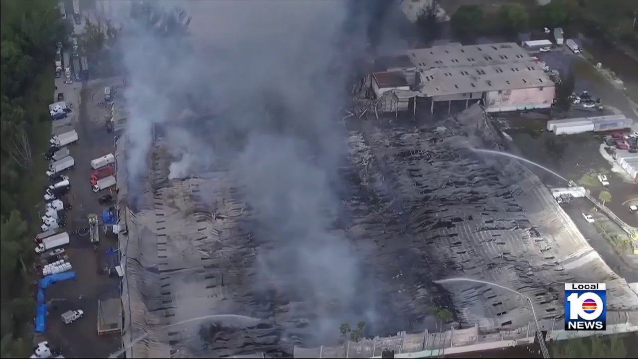 Hot spots still burning after massive warehouse fire in northwest Miami-Dade