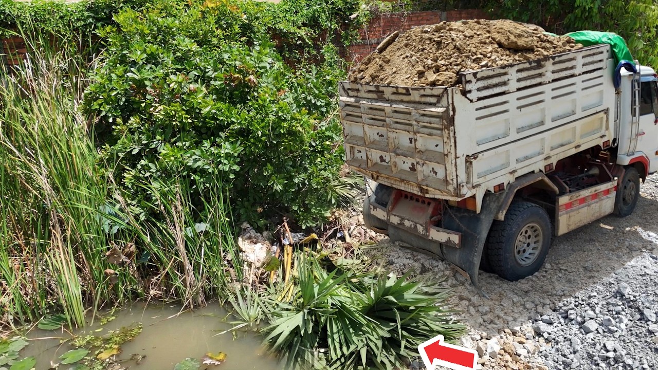 Incredible New landfill using Dump trucks 5ton dumping soil stone and push filling by D31P Bulldozer