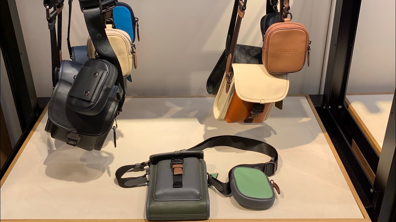 Y882 Немного мужских сумочек из бутика COACH.