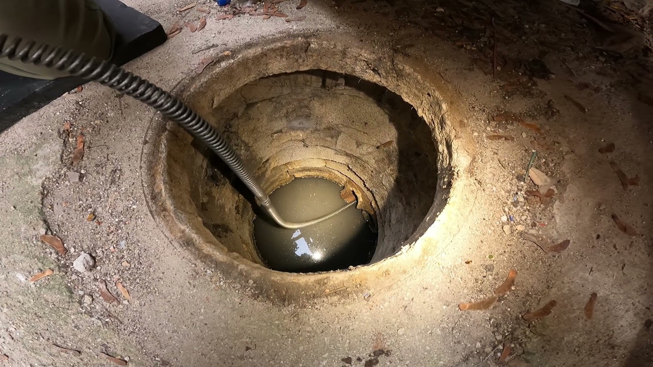 Sewer rodding through a catch basin.
