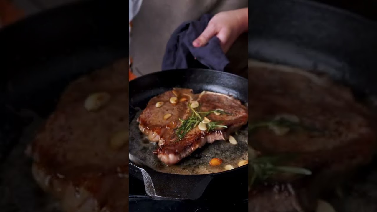 Pan seared porterhouse steak topped with creamy saut&eacute;ed mushrooms