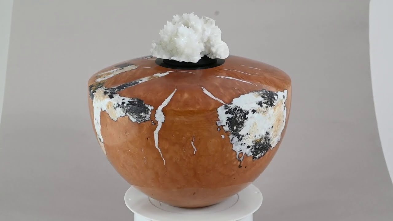Handmade wooden urn of Briar burl with white minerals, Calcite, Belgian Blackstone and gold.