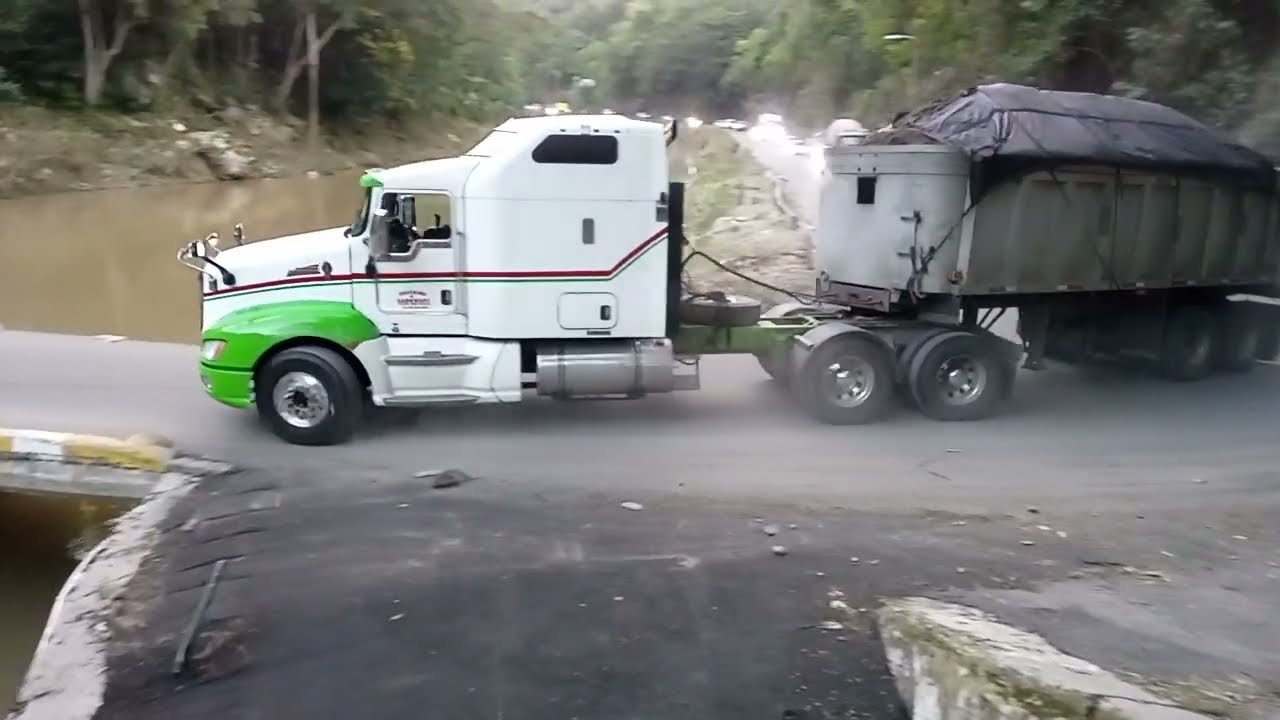 Trucks going across the flat bridge 