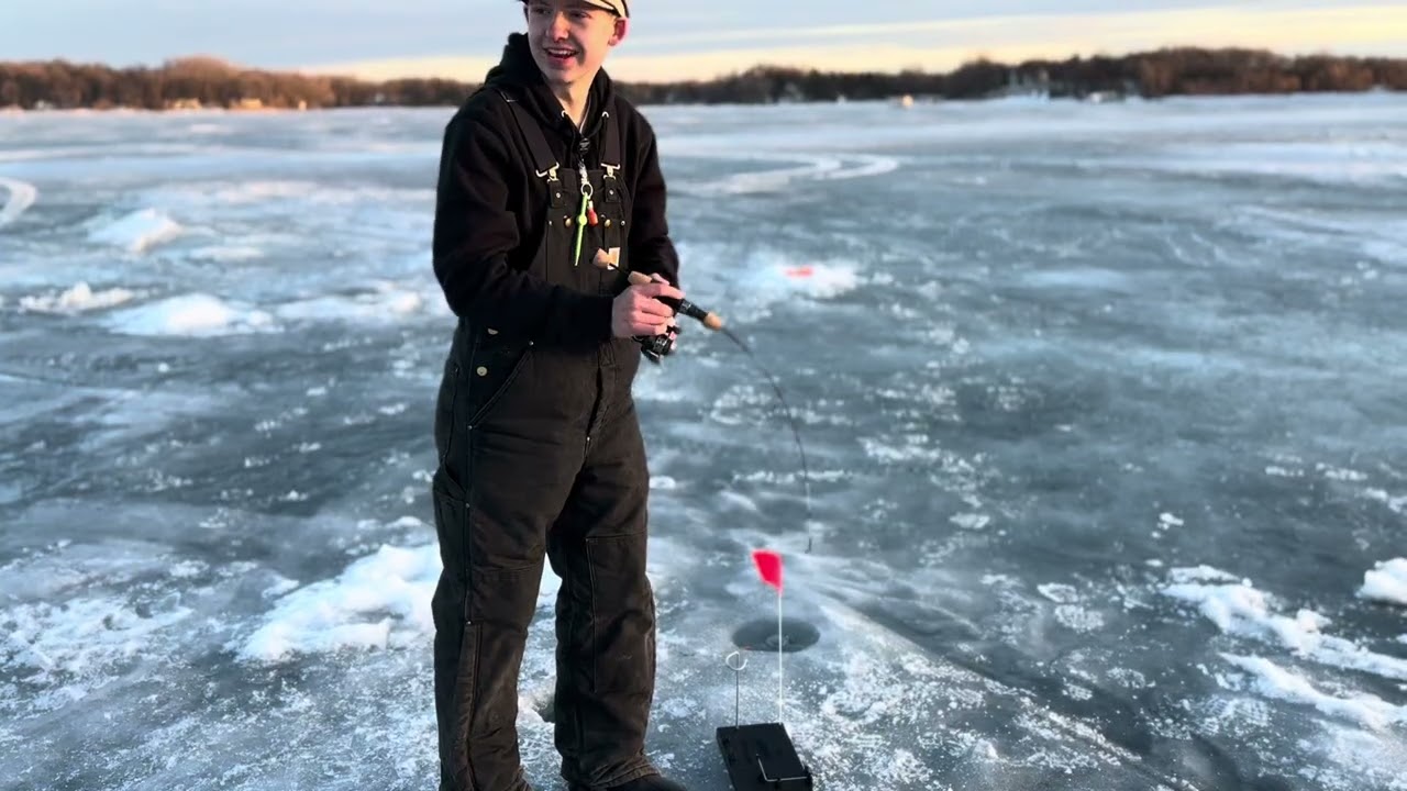 Pulling pike through 2 ft of ice! 