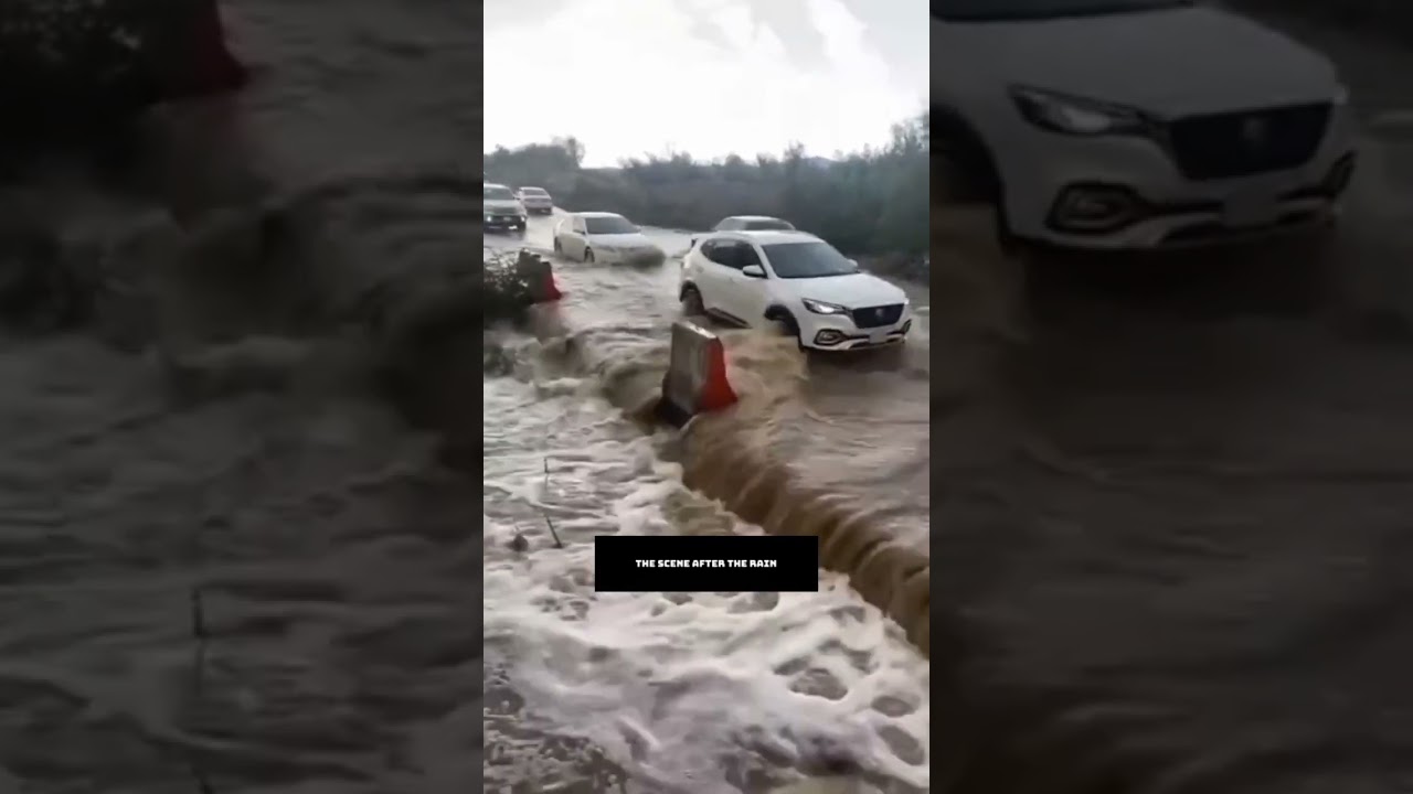 After the rain, the vehicles are passing through the rushing water. #nocopyrightvideochannel