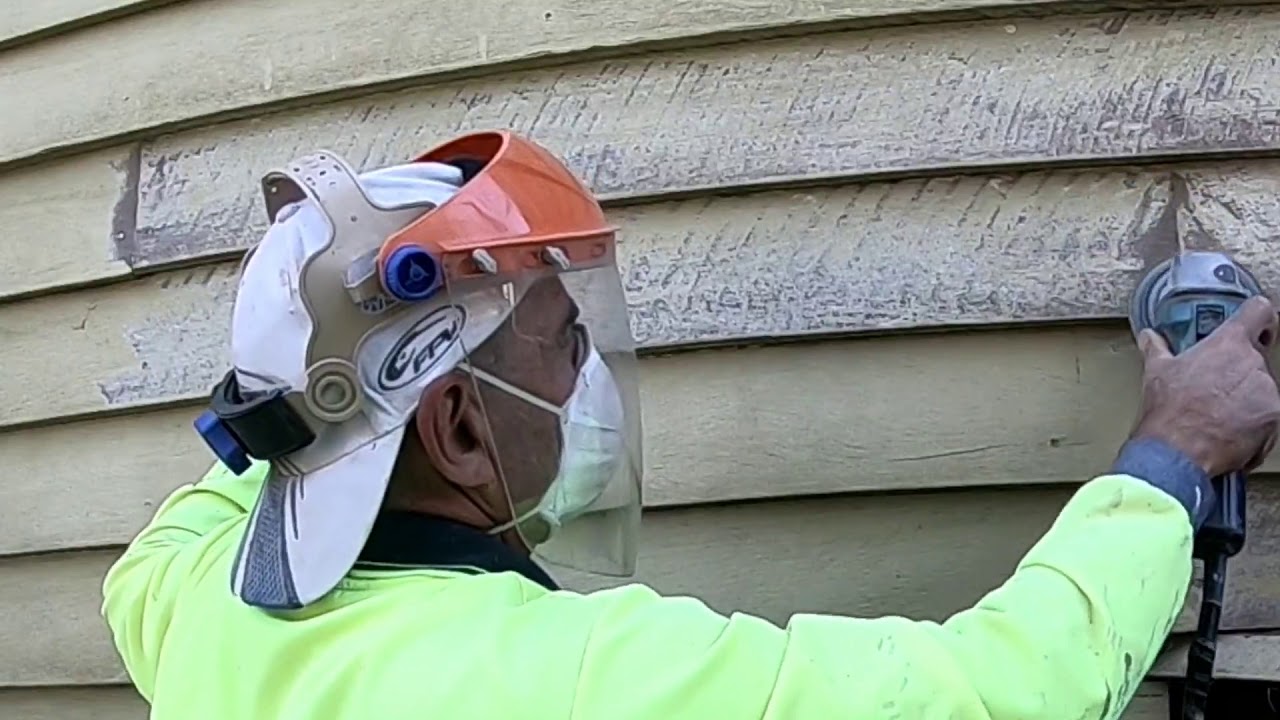 Sanding weatherboards and preparing for painting with 5