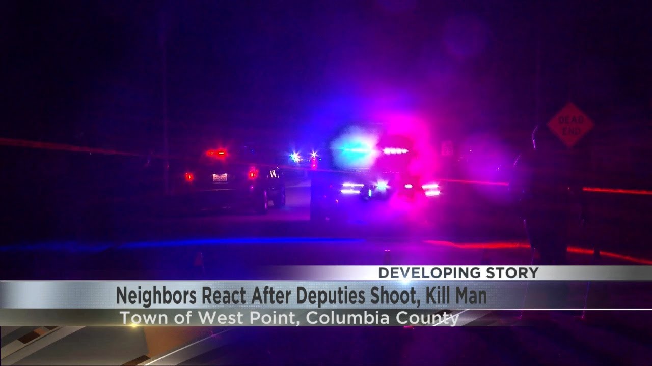 Соседи отреагировали после того, как полицейские застрелили мужчину.