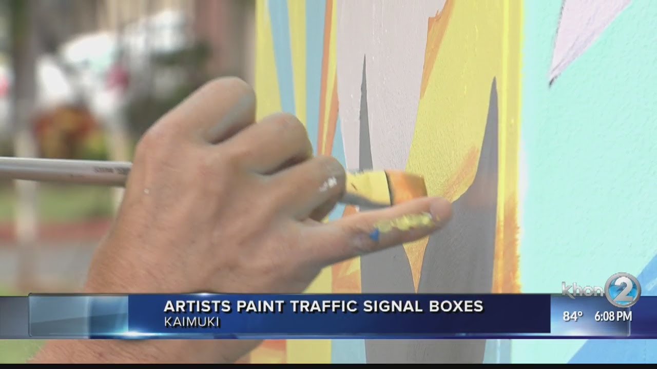 artists paint traffic signal boxes in kaimuki