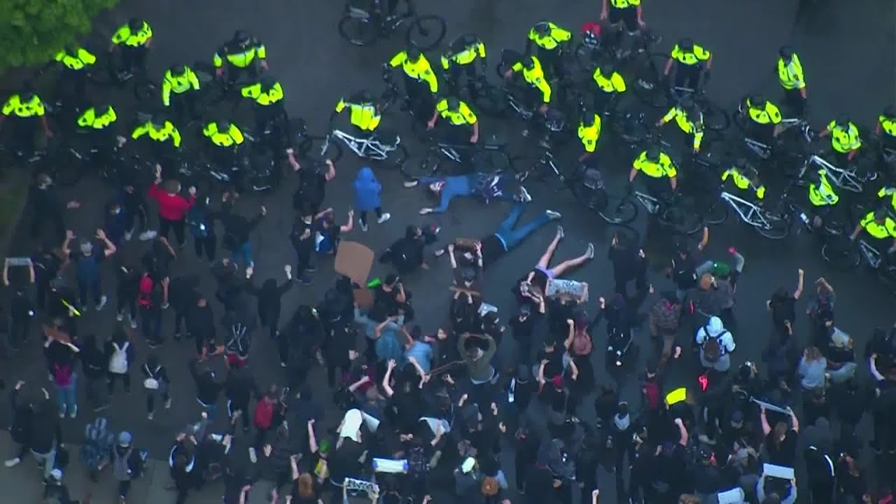 Protesters stage 'die-in' protest outside Boston police station