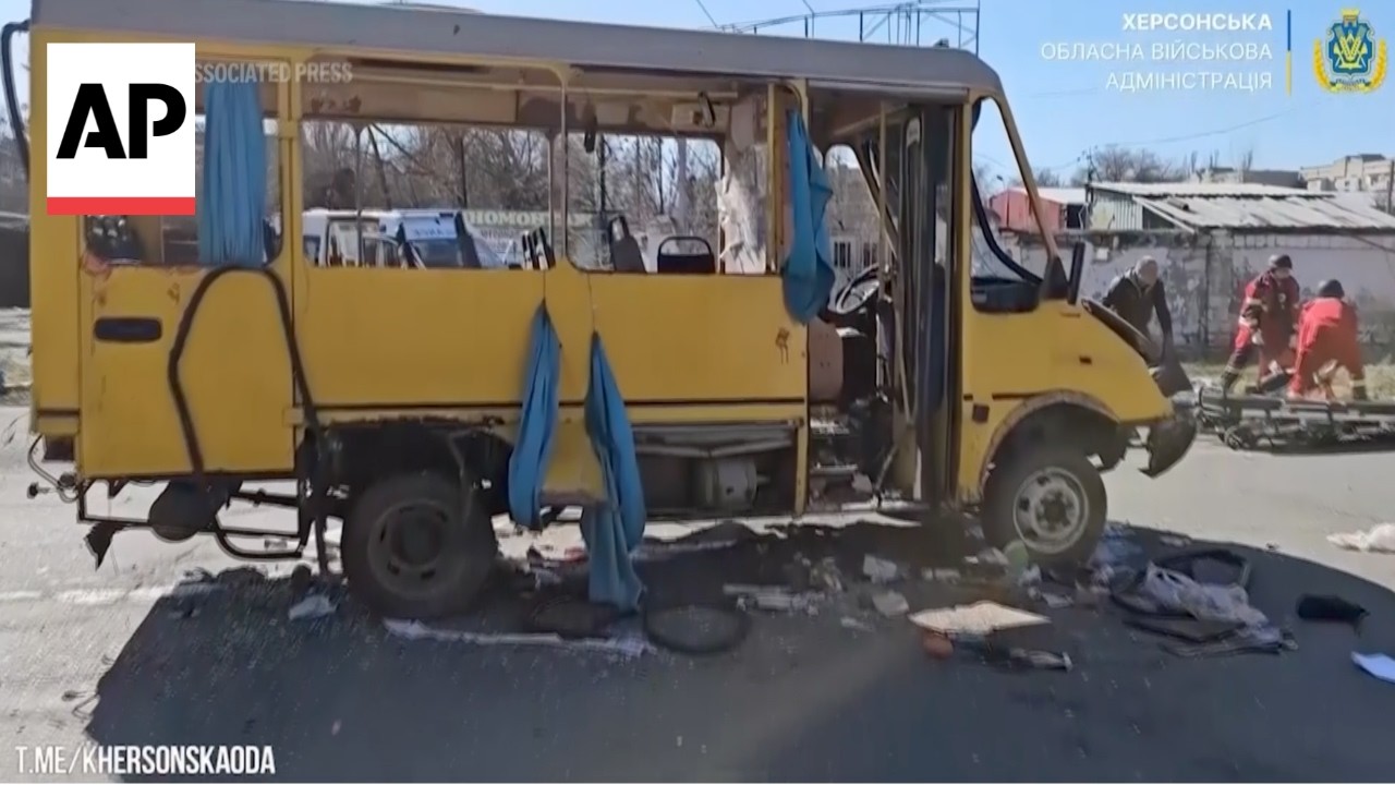 Russia drone strike hits moving bus in Kherson, injured helped into ambulances