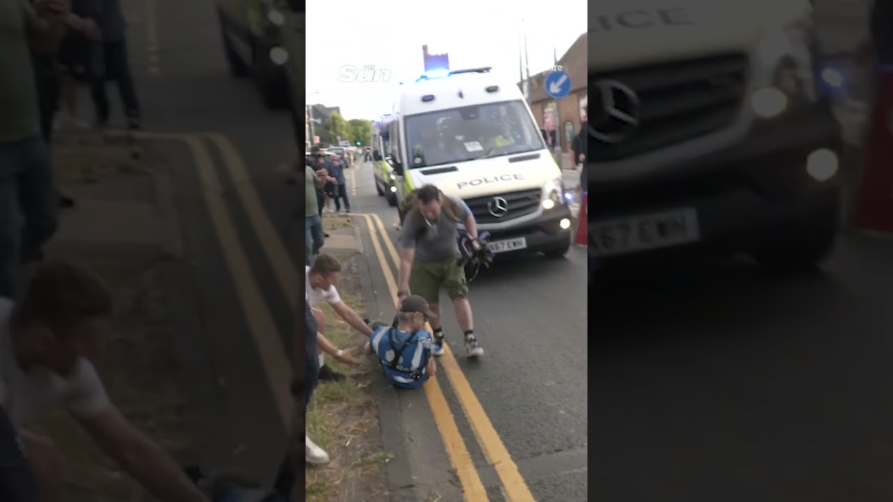 Moment under-siege cops DRIVE INTO protester amid chaos over migrant &lsquo;sex assault&rsquo;
