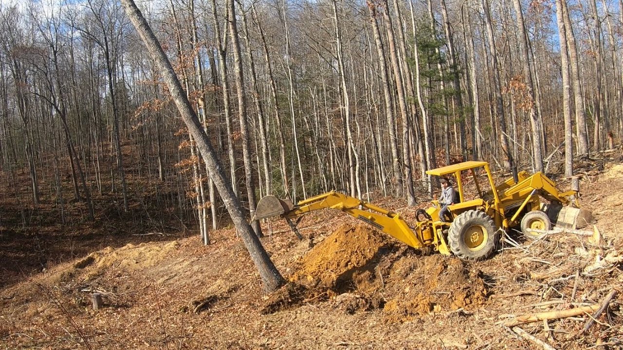 Doing Some Tree Work With a Backhoe