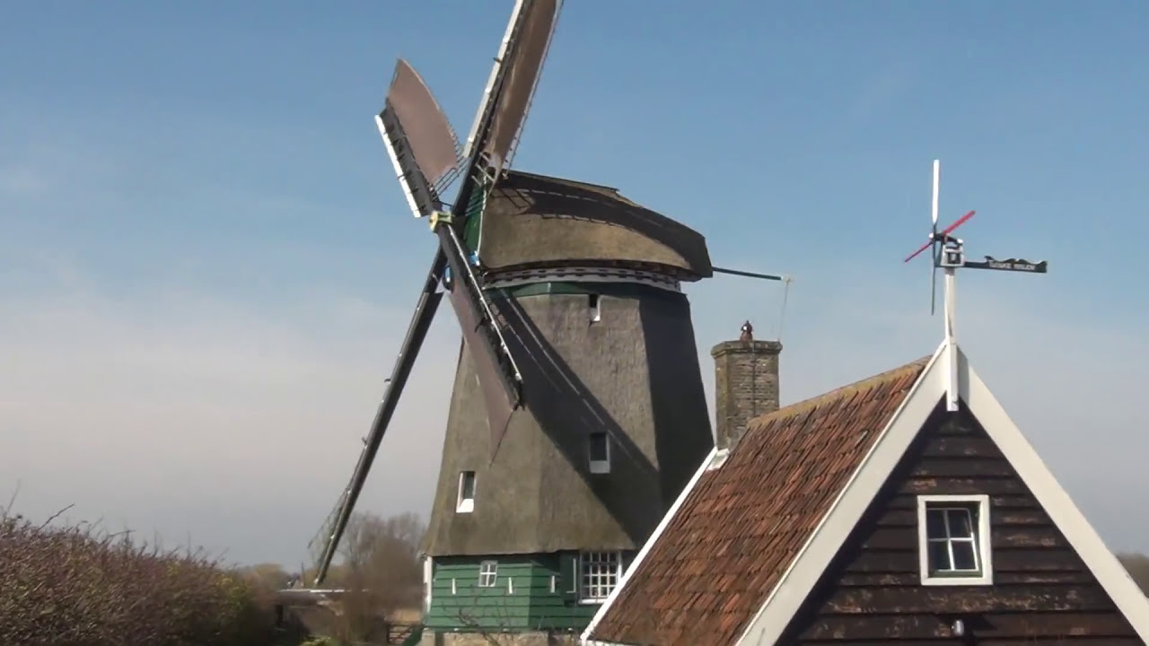 Dutch windmill running in a storm. 