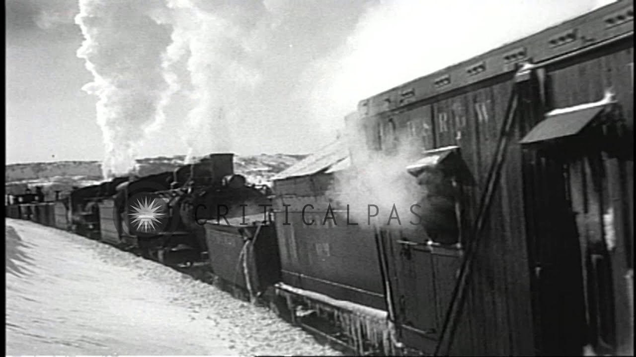 Narrow gauge railroad train equipped with rotary snowplow clears snow from tracks...HD Stock Footage