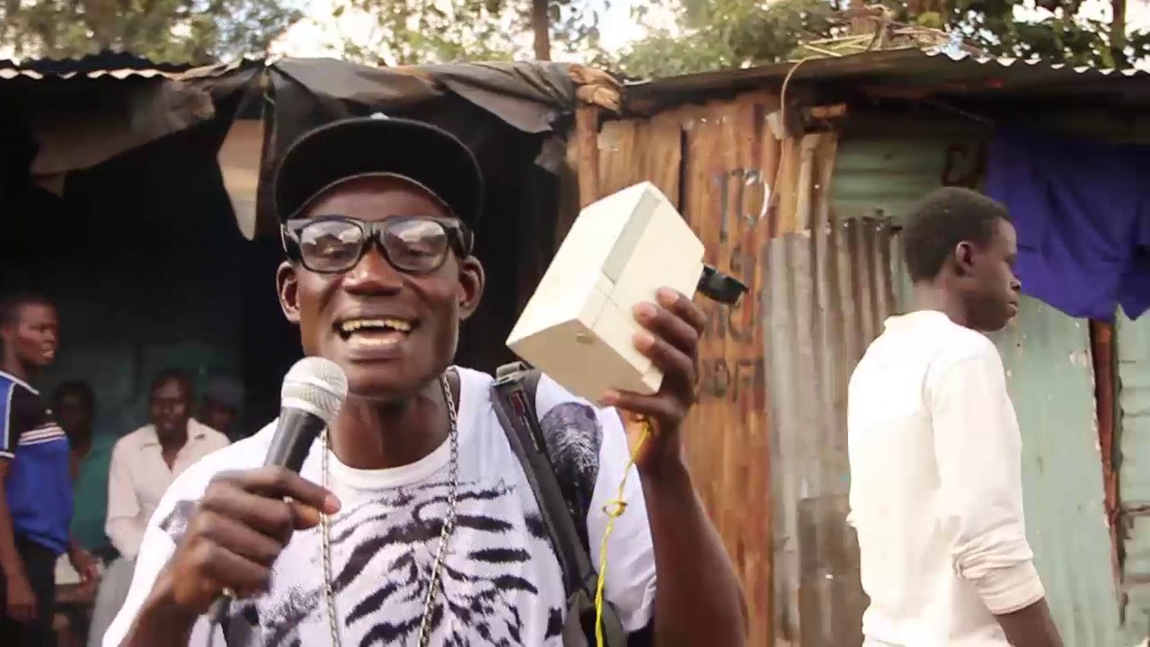 DJ MIKE  doing a solo street Live performance In Kibera