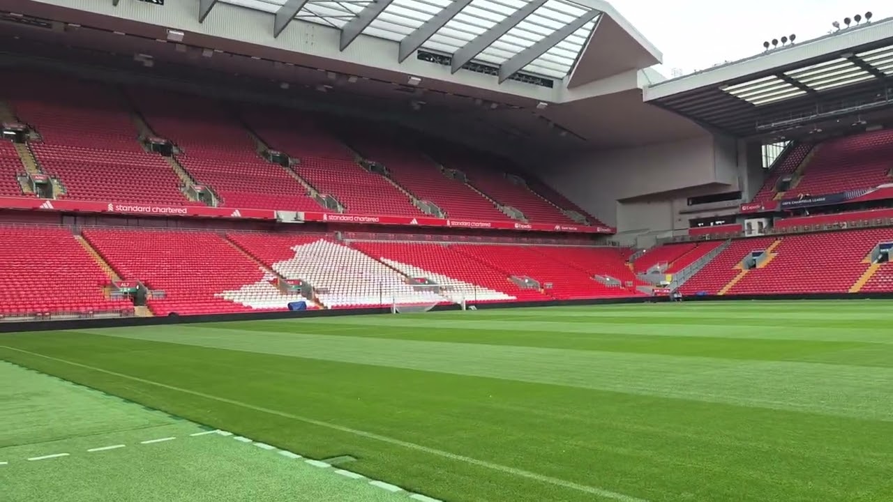 Taking the first step into Anfield Road pitch, Liverpool
