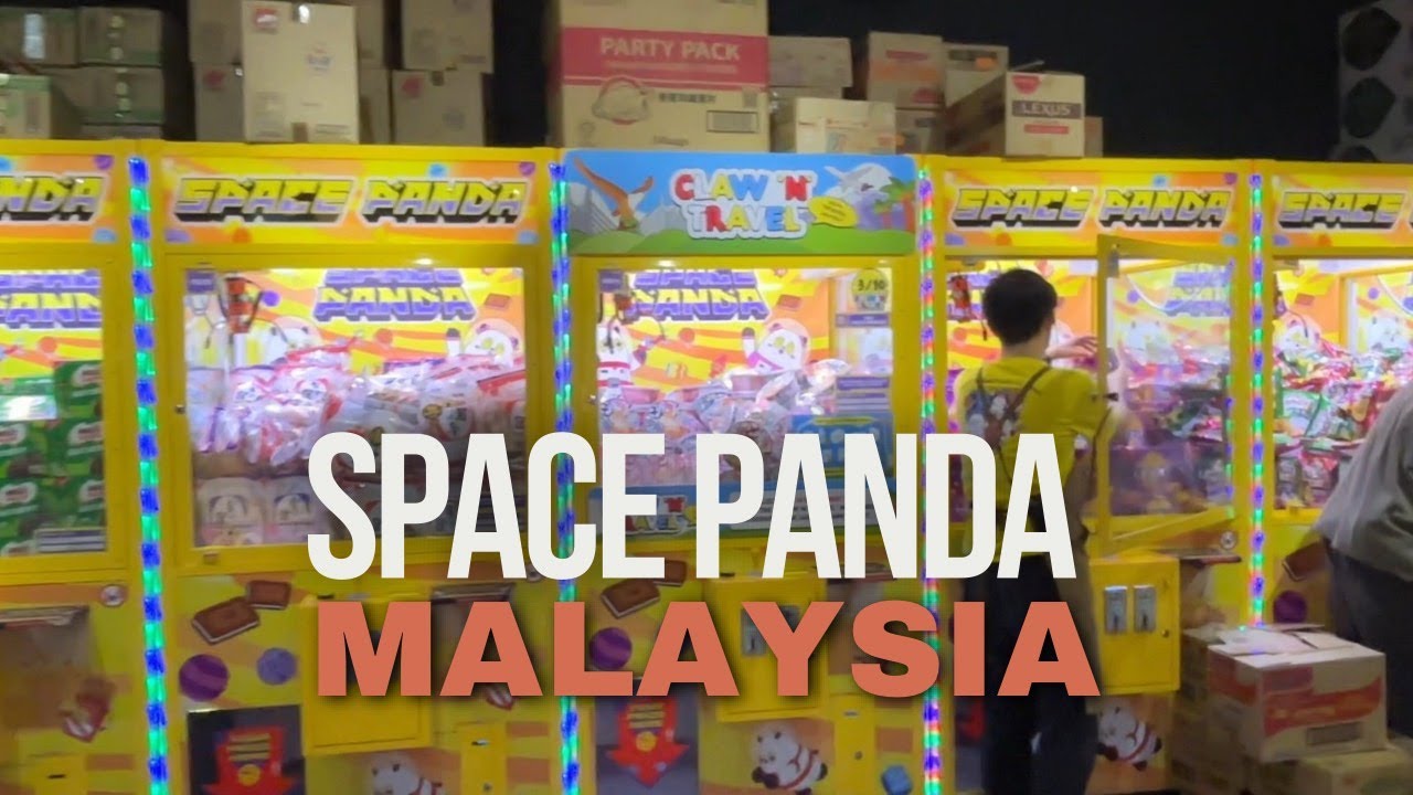 Challenging claw machine at Malaysia Space Panda