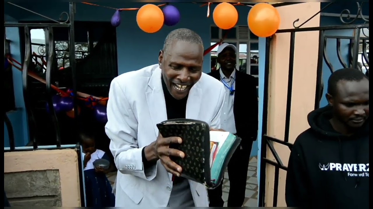 Bishop Koina preaching during David Kileyia's housewarming