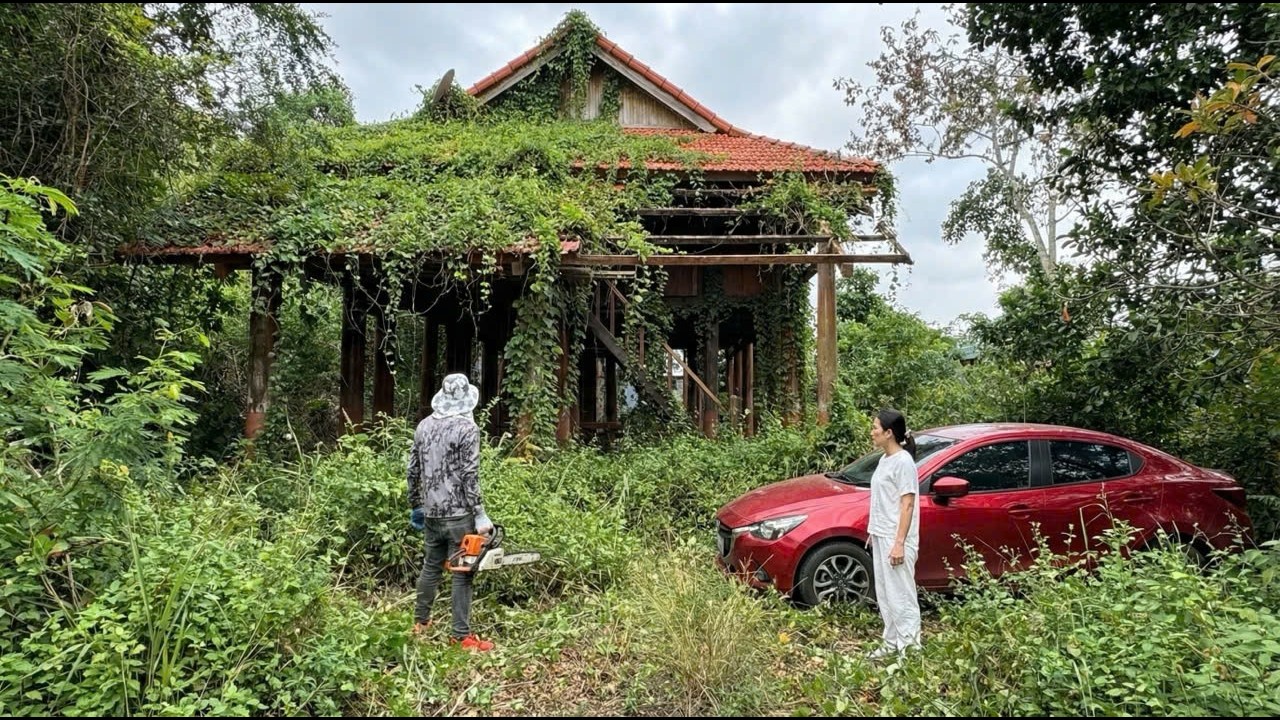The red car struggled to enter the old mansion. She was delighted when I offered to help
