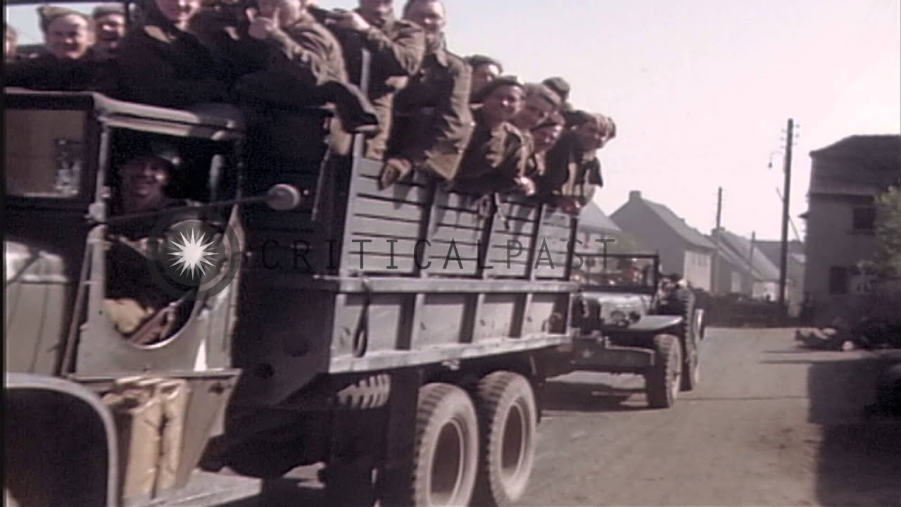 German prisoners marching through streets in Germany under guard of Allied forces...HD Stock Footage
