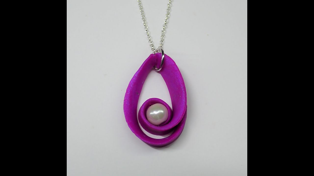 Polymer clay swirl pendant with a pearl