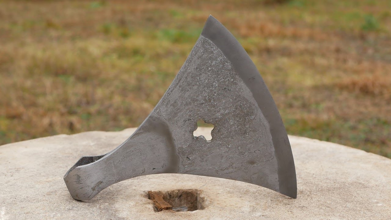 Blacksmithing. Forging medieval Battle axe. Wrought iron.