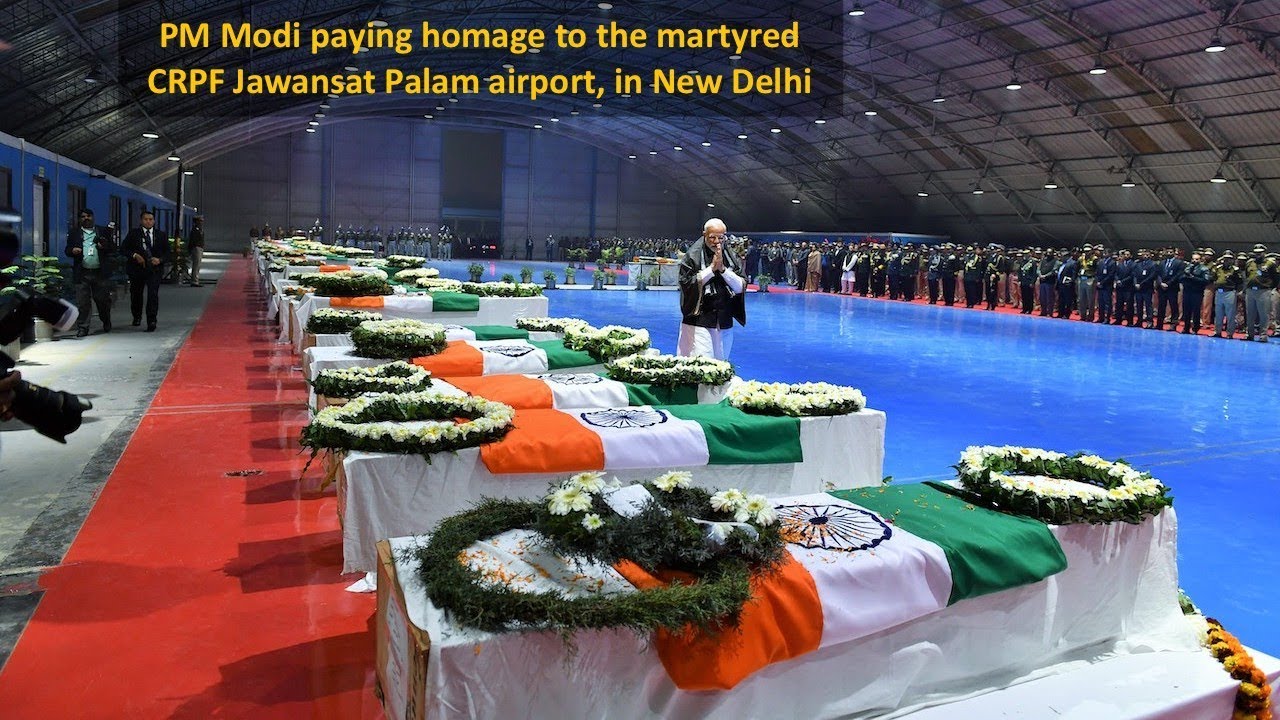 PM Modi paying homage to the martyred CRPF Jawans, at Palam airport, in New Delhi