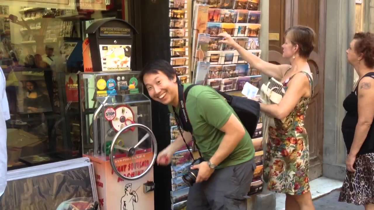 Penny smashing machine outside Accademia in Florence