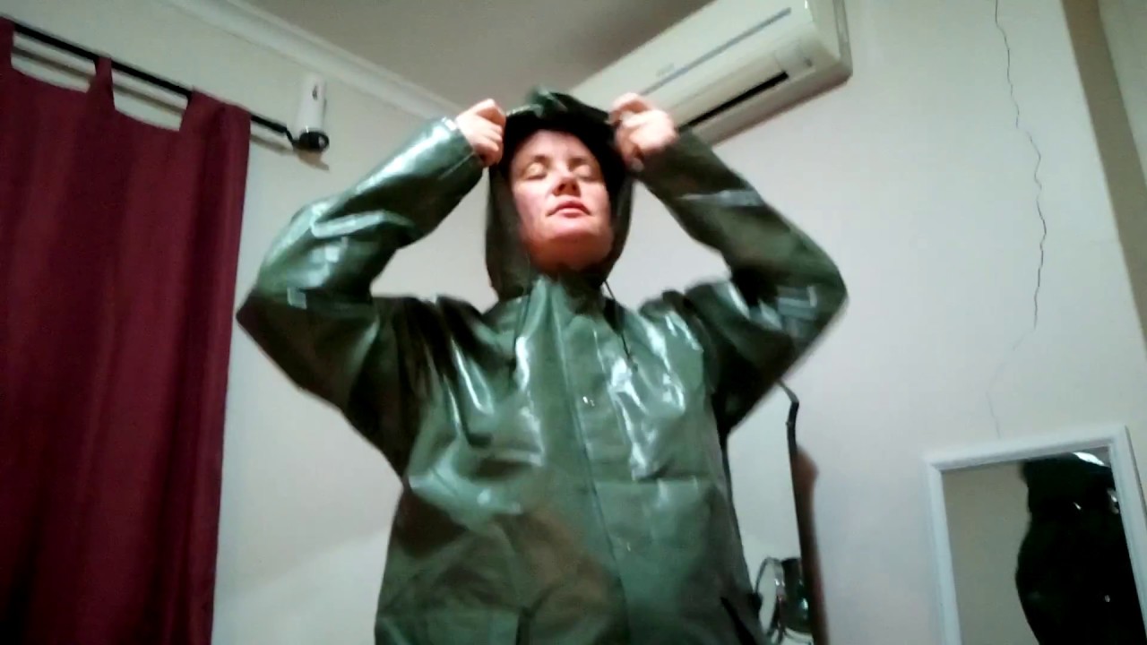 Trying on a military rainsuit