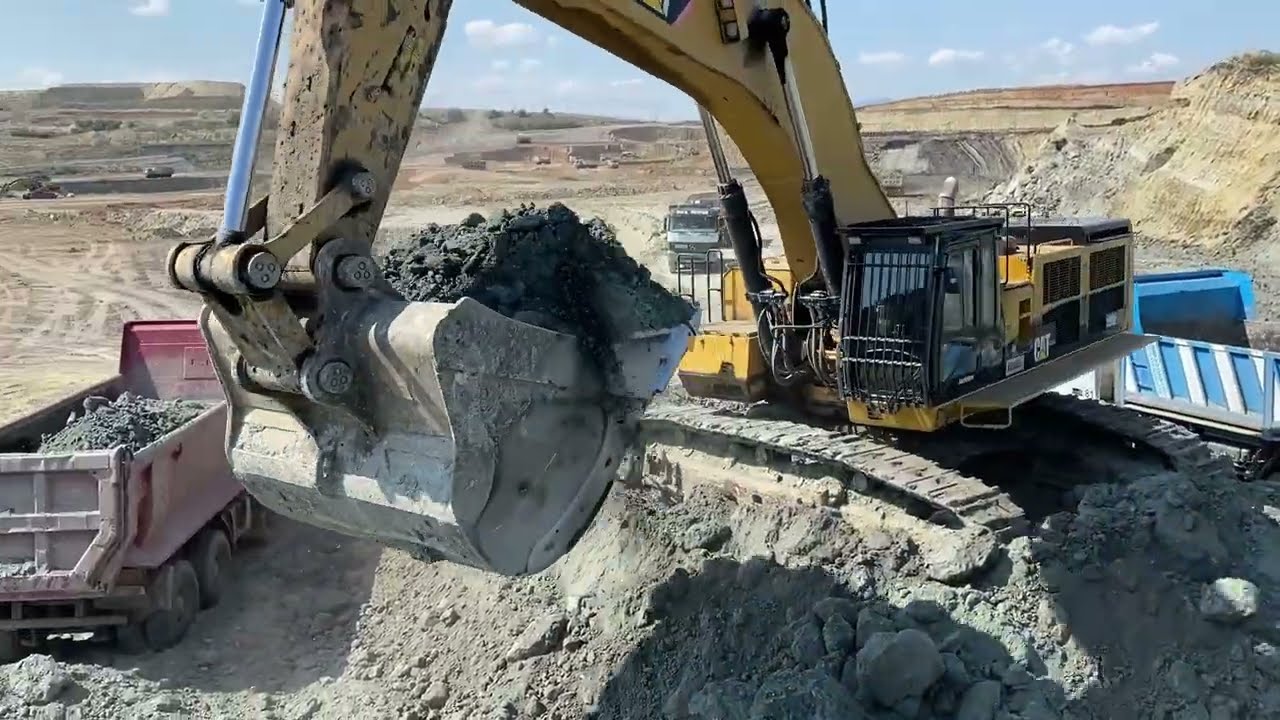 Caterpillar 390D Hydraulic Excavator Loading Mercedes & MAN Trucks - Interkat SA