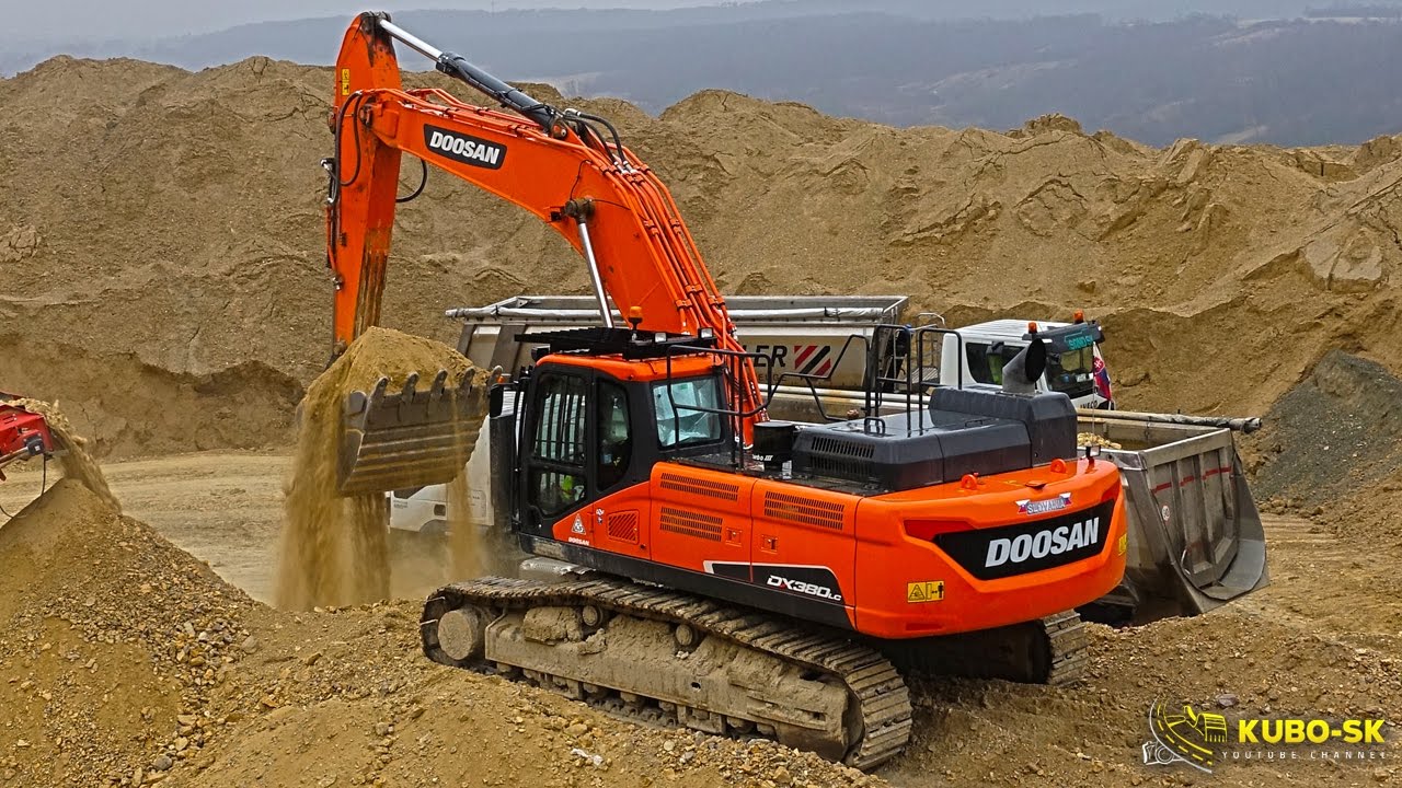 Doosan DX380LC-5 excavator loading semi trucks