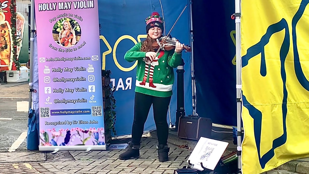 Violinist busker plays In Dulci Jubilo by Mike Oldfield