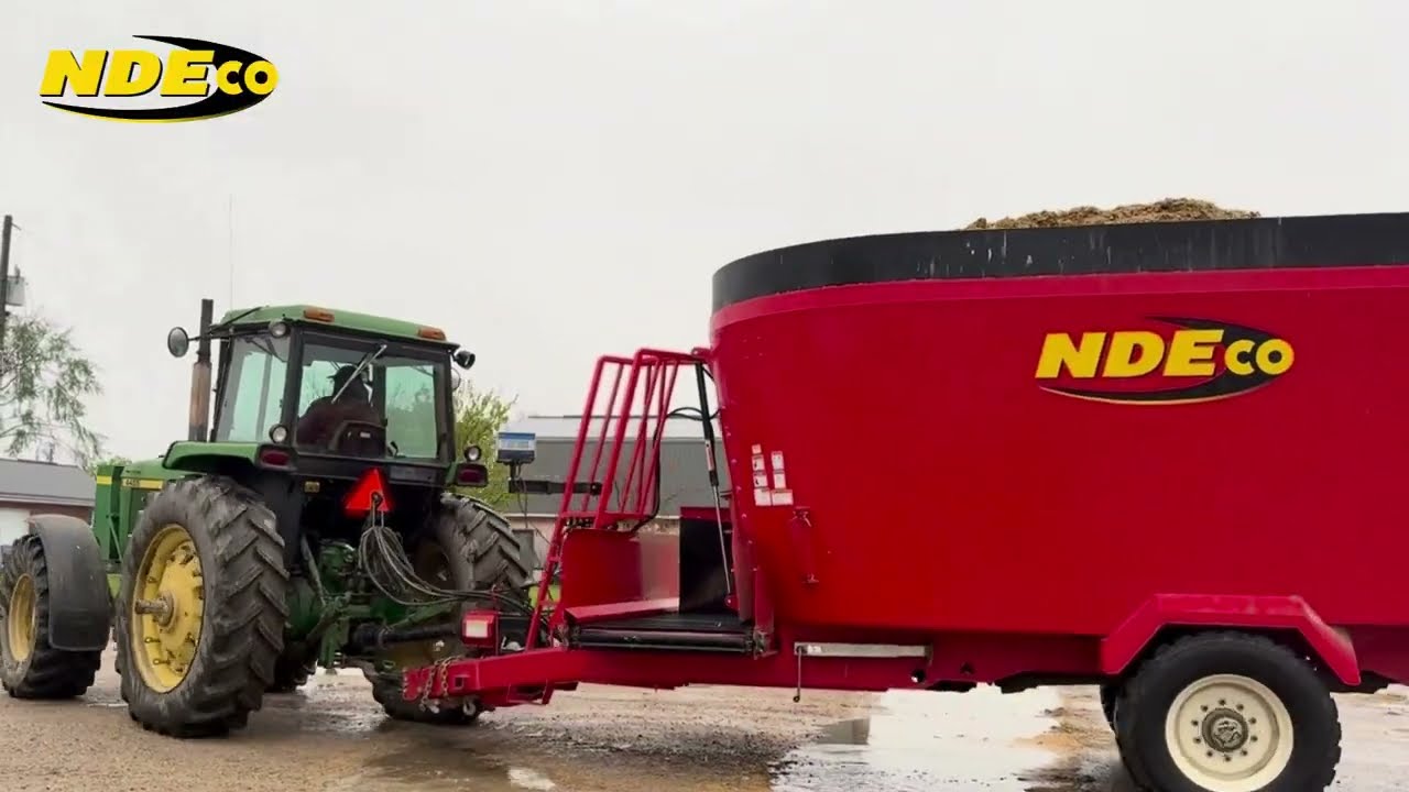 Rain or Shine, NDEco gets the job done.  U850 Feed Mixer on a Dairy Farm in southern Ontario.