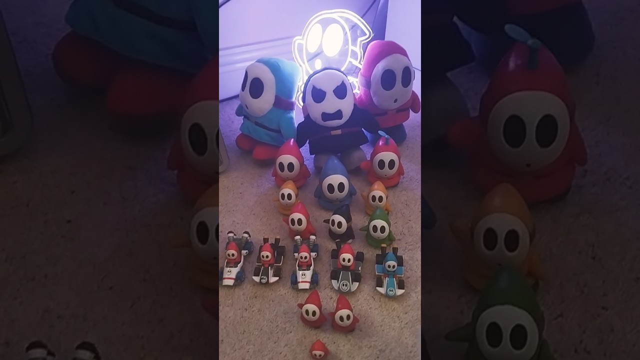All my Shy Guy plushies and figures and my Shy Guy light 💚💛💙❤️🖤