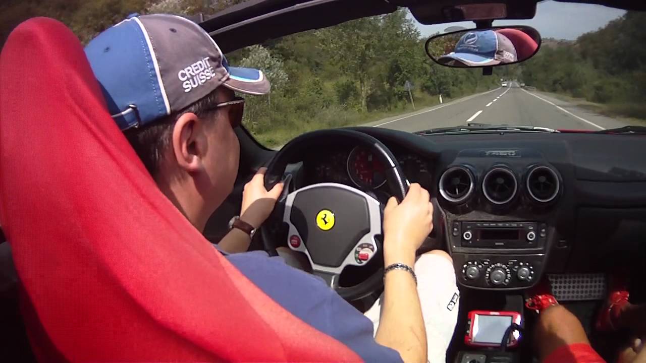 Driving Ferrari F430 Spider at high speed road
