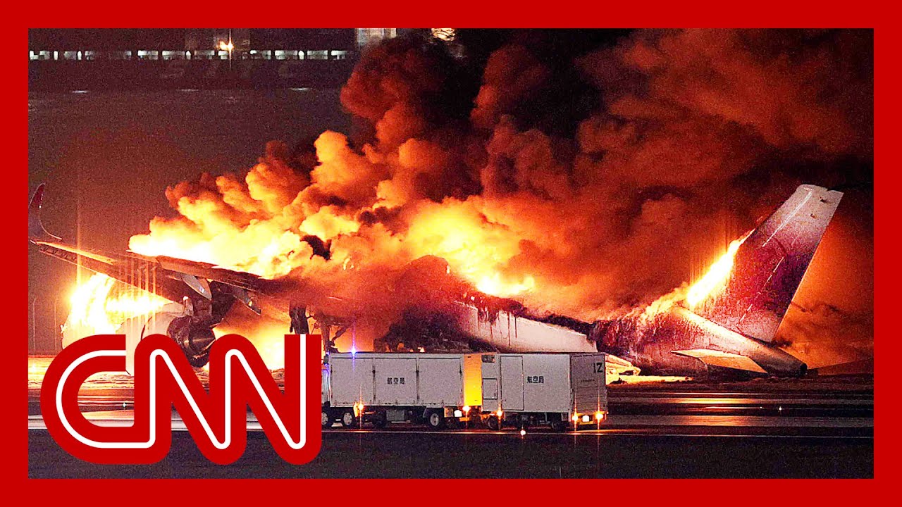 Fully booked flight burst into flames after landing in Tokyo