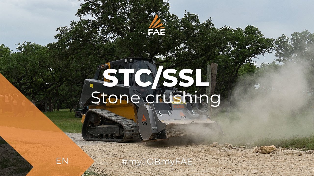 FAE stone crusher with a John Deere 333G skid steer
