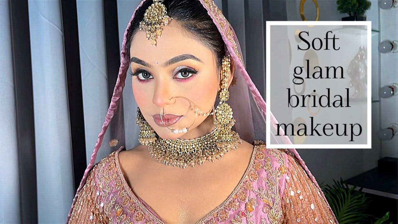 Soft bridal makeup on bride wearing pink lehenga