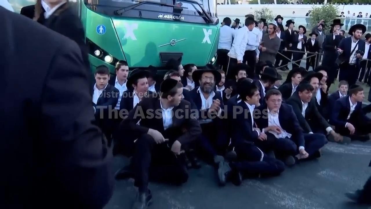 Ultra-Orthodox protesters block roads and trains across Israel over military draft