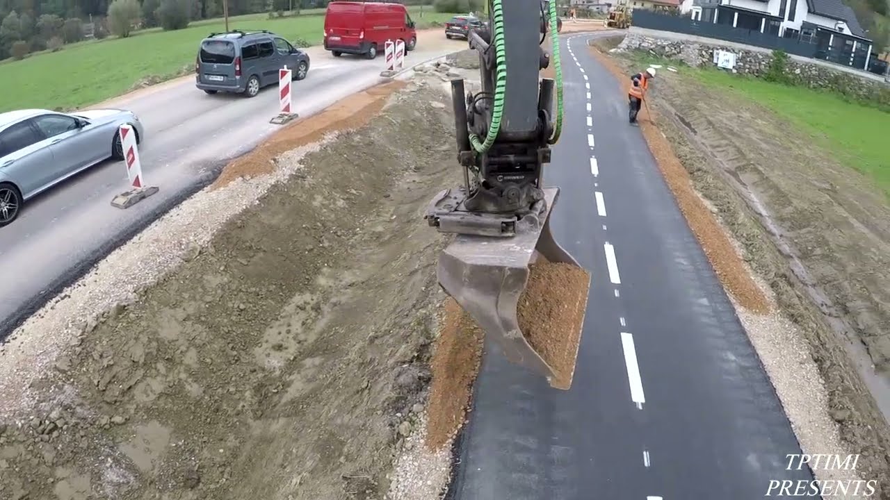 Filling Road Shoulder With Gravel Using A Tiltrotator