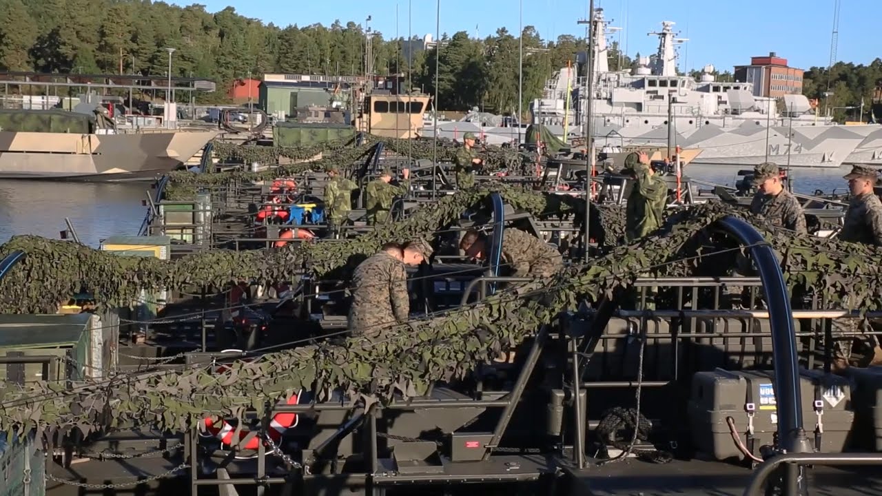 U.S. Marines follow safety demonstrations aboard a Swedish Combat Boat 90